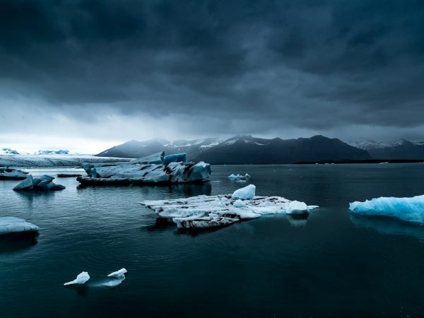 glacier near body of water