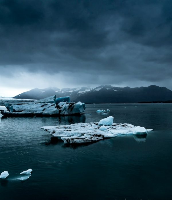glacier near body of water